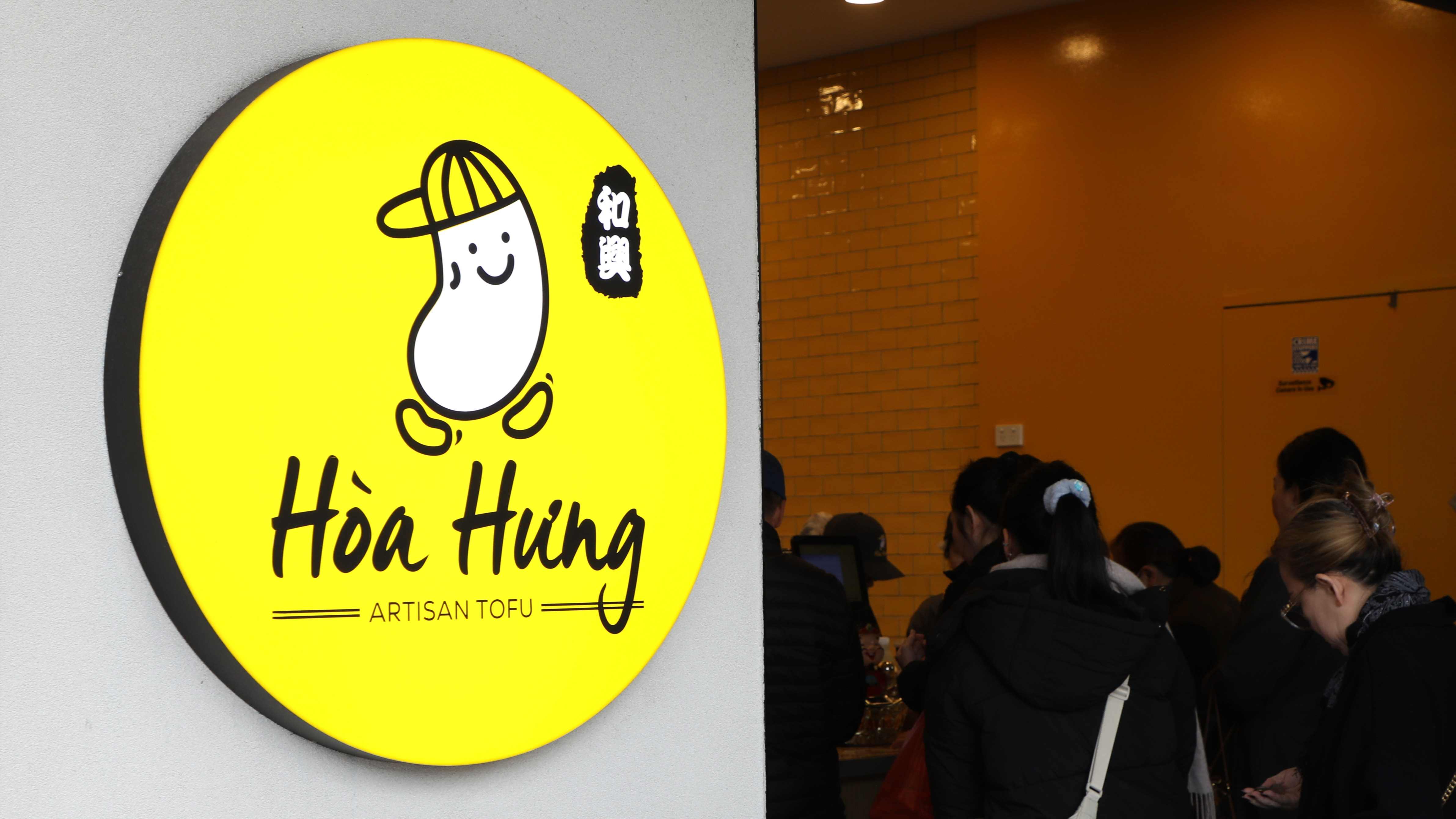 Customers at the Hoa Hung tofu shopfront